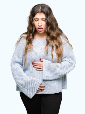Young beautiful woman wearing winter sweater with hand on stomach because nausea, painful disease feeling unwell. Ache concept. clipart