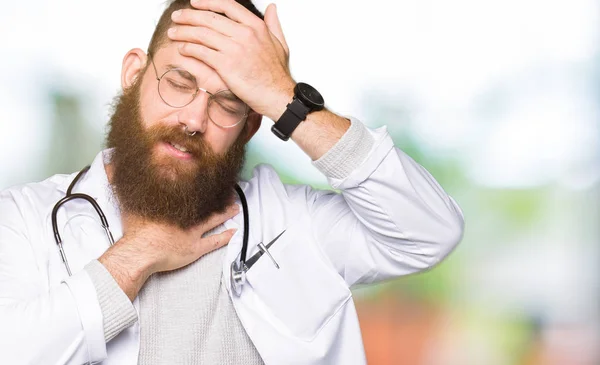 Young Blond Doctor Man Beard Wearing Medical Coat Touching Forehead — Stock Photo, Image