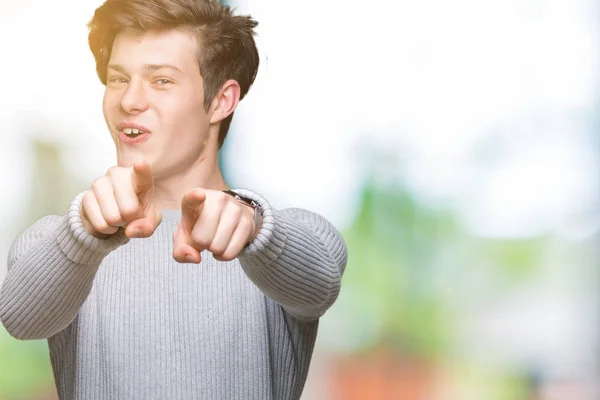 Joven Hombre Guapo Con Suéter Invierno Sobre Fondo Aislado Señalando —  Fotos de Stock