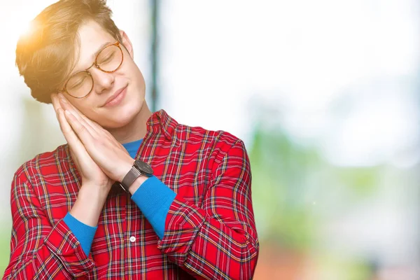 Joven Hombre Guapo Con Gafas Sobre Fondo Aislado Durmiendo Cansado —  Fotos de Stock