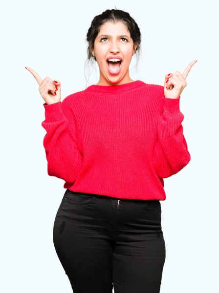 Junge Schöne Frau Rotem Pullover Und Dutt Erstaunt Und Überrascht — Stockfoto