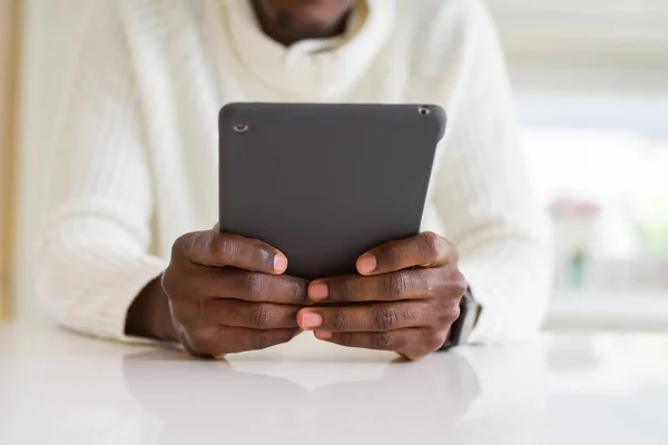 Close up of african business man using touchpad tablet, working — Stock Photo, Image