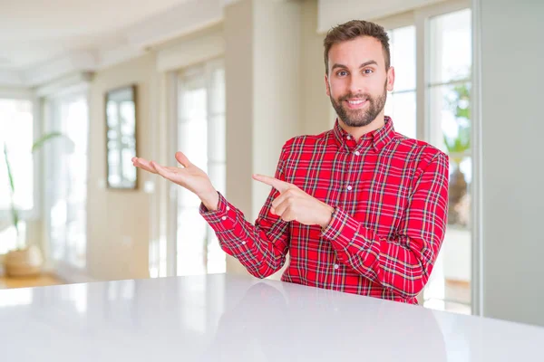Handsome Man Wearing Colorful Shirt Amazed Smiling Camera While Presenting — Stock Photo, Image