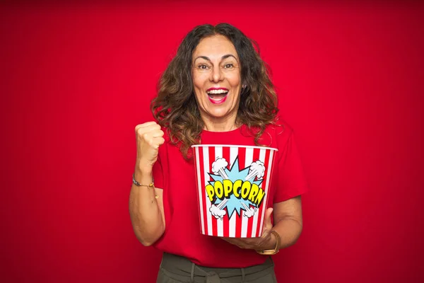 Middle Age Senior Woman Eating Popcorn Snack Red Isolated Background — Stock Photo, Image