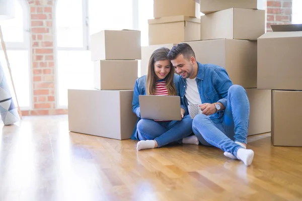 Young Couple Sitting Floor Cardboard Boxes Using Computer Laptop Very — Stock Photo, Image