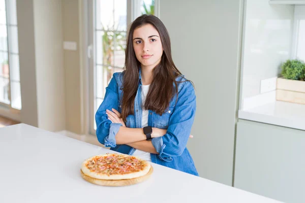 Beautiful Young Woman Eating Homemade Tasty Pizza Kitchen Skeptic Nervous — Stock Photo, Image