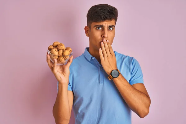 Young Indian Man Holding Bowl Walnuts Standing Isolated Pink Background — Stock Photo, Image