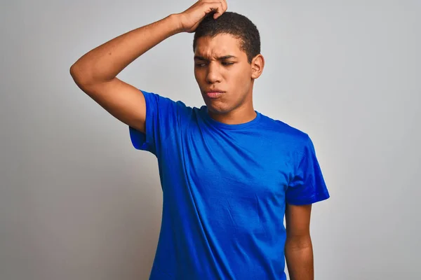 Young Handsome Arab Man Wearing Blue T Shirt Standing Over Isolated White Background Confuse And Wonder About Question Uncertain With Doubt Thinking With Hand On Head Pensive Concept Stock Images Page Young Handsome Arab Man Wearing Blue T Shirt Standing Over Isolated White Background Confuse And Wonder About Question Uncertain With Doubt Thinking With Hand On Head Pensive Concept Stock Images Page