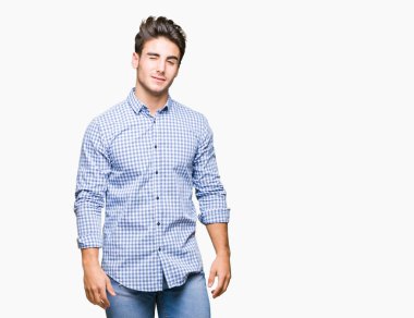 Genç yakışıklı iş adamı seksi bir ifadeyle, neşeli ve mutlu yüzünü kameraya bakarak göz kırpıyor izole arka plan üzerinde.