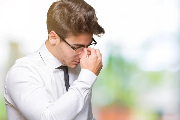 Joven Hombre Negocios Con Gafas Sobre Fondo Aislado Cansado Frotando —  Fotos de Stock