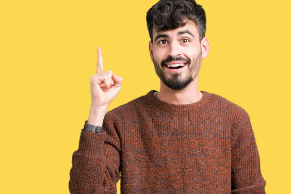 Jovem Homem Bonito Vestindo Camisola Inverno Sobre Fundo Isolado Apontando — Fotografia de Stock