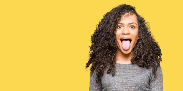 Young Beautiful Woman Curly Hair Wearing Grey Sweater Sticking Tongue — Stock Photo, Image