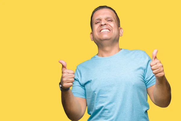 Hombre Árabe Mediana Edad Vistiendo Camiseta Azul Sobre Signo Éxito —  Fotos de Stock