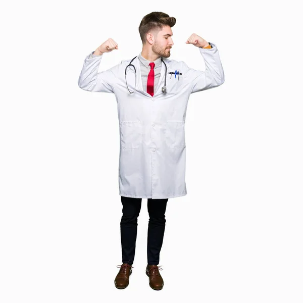 Young Handsome Doctor Man Wearing Medical Coat Showing Arms Muscles — Stock Photo, Image