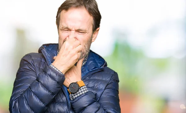 Middle Age Handsome Man Wearing Winter Coat Smelling Something Stinky — Stock Photo, Image