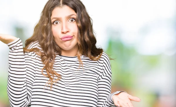 Young Beautiful Woman Wearing Stripes Sweater Clueless Confused Expression Arms — Stock Photo, Image