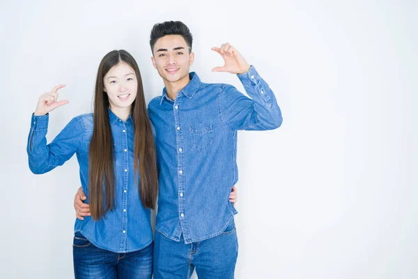 Beautiful Young Asian Couple White Isolated Background Smiling Confident Gesturing — Stock Photo, Image