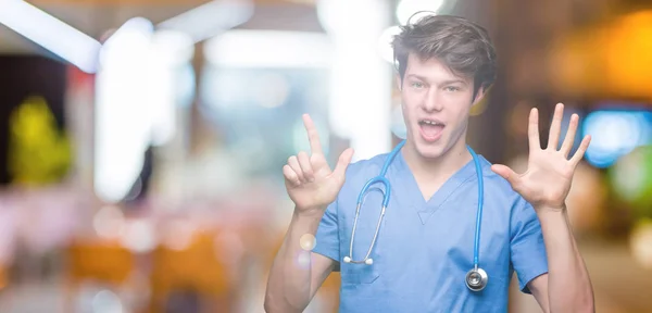Young Doctor Wearing Medical Uniform Isolated Background Showing Pointing Fingers — Stock Photo, Image