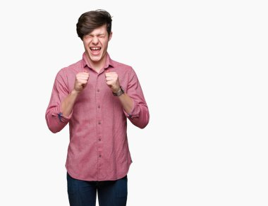 Genç yakışıklı iş adamı izole arka kolları olan başarı için heyecan üzerinde zafer kutluyor gülümseyen kaldırdı. Kazanan kavramı.