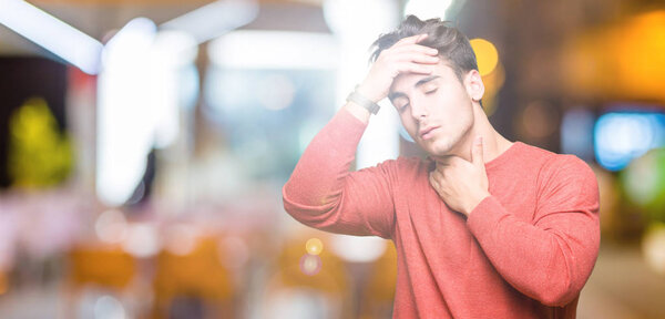 Young handsome man over isolated background Touching forehead for illness and fever, flu and cold, virus sick