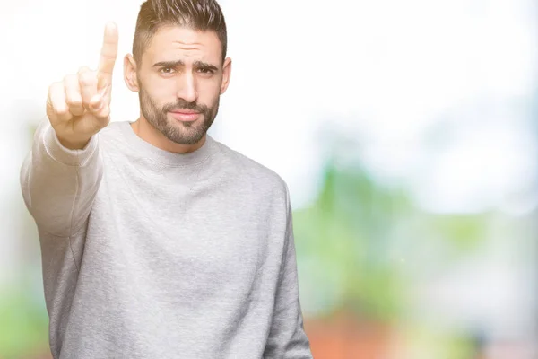 Joven Hombre Guapo Con Sudadera Sobre Fondo Aislado Señalando Con —  Fotos de Stock