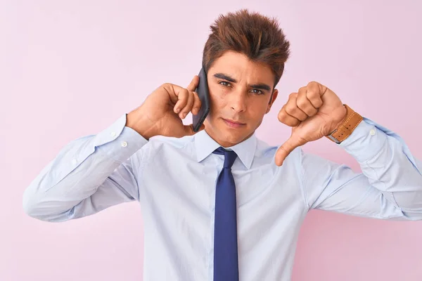 Young Handsome Businessman Talking Smartphone Isolated Pink Background Angry Face — Stock Photo, Image