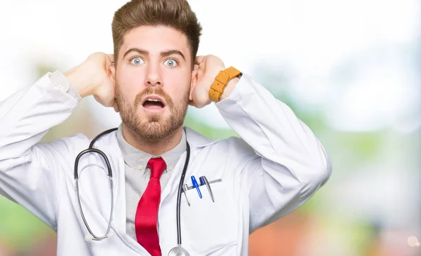 Young Handsome Doctor Man Wearing Medical Coat Crazy Scared Hands — Stock Photo, Image