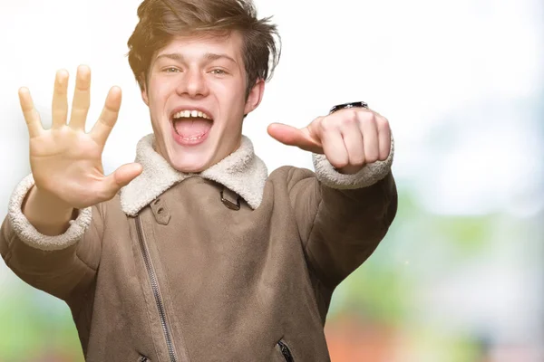 Young Handsome Man Wearing Winter Coat Isolated Background Showing Pointing — Stock Photo, Image