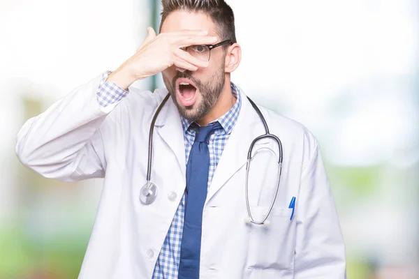 Handsome Young Doctor Man Isolated Background Peeking Shock Covering Face — Stock Photo, Image