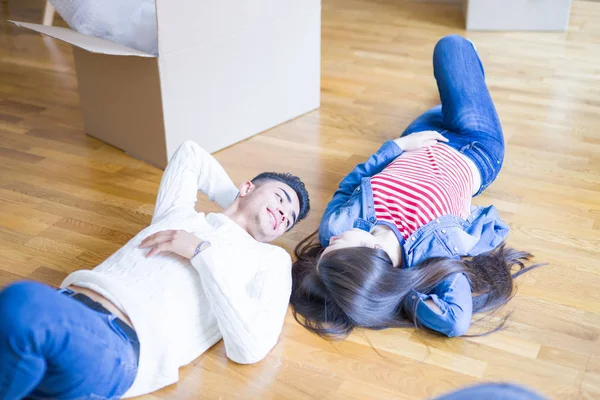 Young Asian Couple Lying Floor New House Arround Cardboard Boxes — Stock Photo, Image