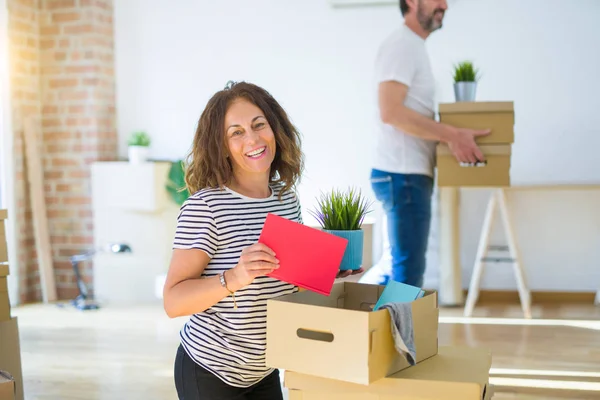 Middle age senior couple moving to a new house