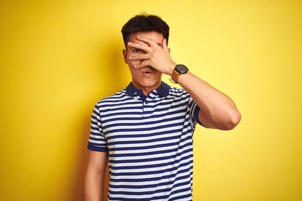 Young Asian Chinese Man Wearing Striped Polo Standing Isolated Yellow — Stock Photo, Image