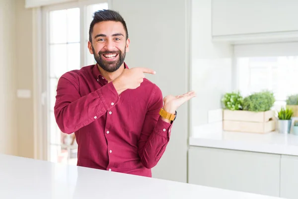 Handsome Hispanic Business Man Amazed Smiling Camera While Presenting Hand — Stock Photo, Image