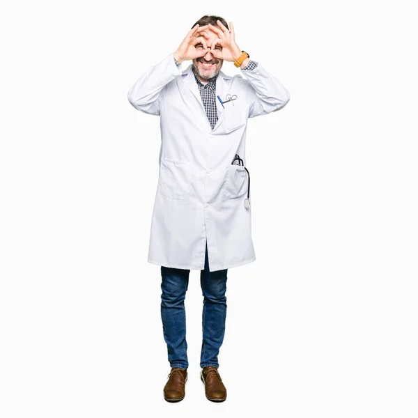 Middle Age Doctor Men Wearing Medical Coat Doing Gesture Binoculars — Stock Photo, Image