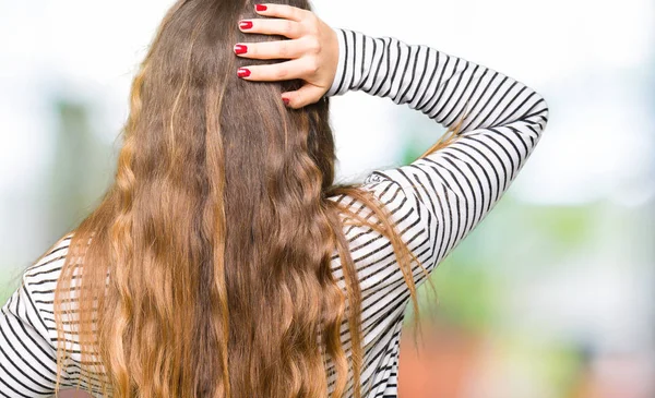 Young Beautiful Woman Wearing Stripes Sweater Backwards Thinking Doubt Hand — Stock Photo, Image