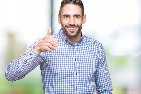 Joven Hombre Guapo Sobre Fondo Aislado Haciendo Pulgares Felices Gesto —  Fotos de Stock