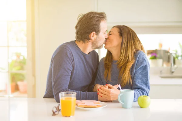 Beautiful romantic middle age couple kissing having healthy brea — Stock Photo, Image