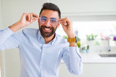Handsome business man wearing glasses and smiling cheerful with  clipart