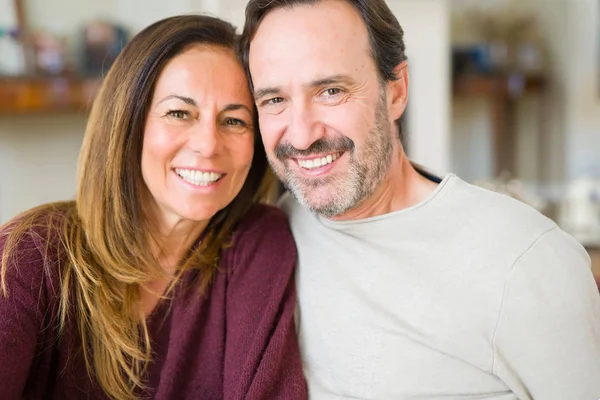 Beautiful romantic couple sitting together on the floor at home — Stock Photo, Image