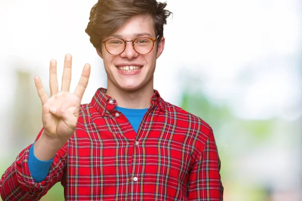 Pemuda Tampan Memakai Kacamata Atas Latar Belakang Terisolasi Menunjukkan Dan — Stok Foto