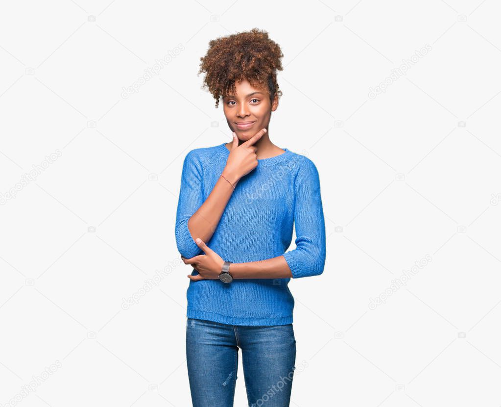 Beautiful young african american woman over isolated background looking confident at the camera with smile with crossed arms and hand raised on chin. Thinking positive.