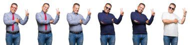 Orta yaş Arap adam mutlu yüz zafer işareti yaparken kameraya göz kırpıyor ile gülümseyen izole arka plan üzerinde bileşimi. İki numaralı.