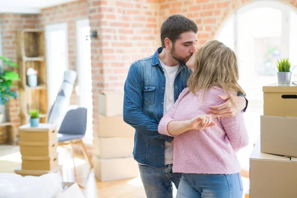 Young couple dancing celebrating moving to new apartment around — Stock Photo, Image