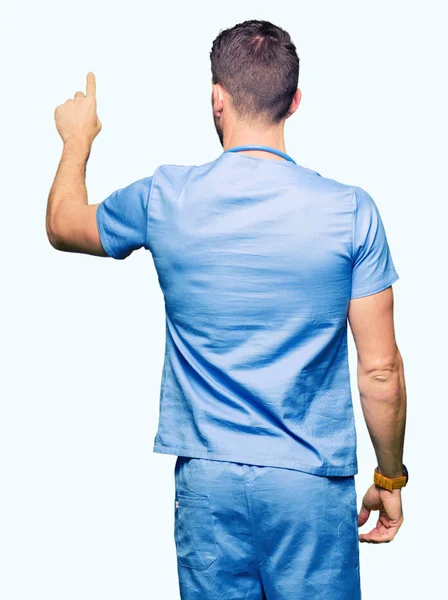 Handsome Doctor Man Wearing Medical Uniform Isolated Background Posing Backwards — Stock Photo, Image