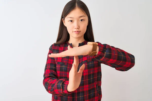 Young chinese woman wearing casual jacket standing over isolated white background Doing time out gesture with hands, frustrated and serious face