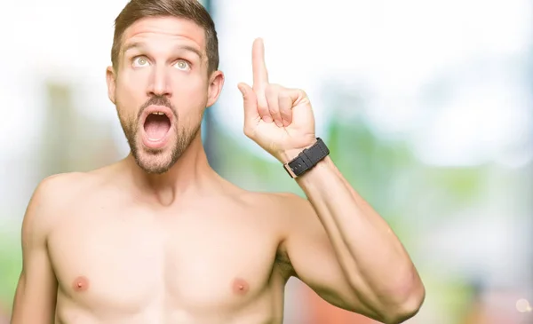 Handsome Shirtless Man Showing Nude Chest Pointing Finger Successful Idea — Stock Photo, Image