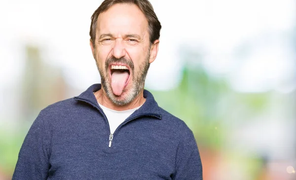 Middle Age Handsome Man Wearing Sweater Sticking Tongue Out Happy — Stock Photo, Image