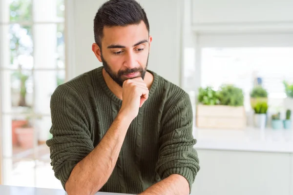 Handsome man thinking confused about doubt, questioning an idea