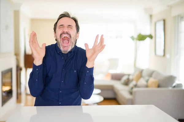 Handsome Middle Age Man Home Celebrating Mad Crazy Success Arms — Stock Photo, Image