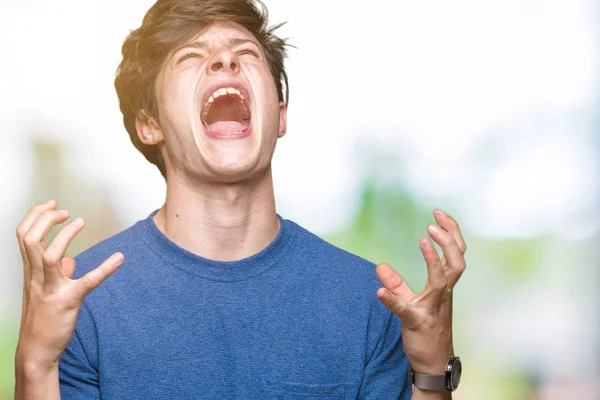 Joven Hombre Guapo Con Camiseta Azul Sobre Fondo Aislado Loco — Foto de Stock